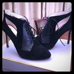 Pair of black suede pointed-toe pumps